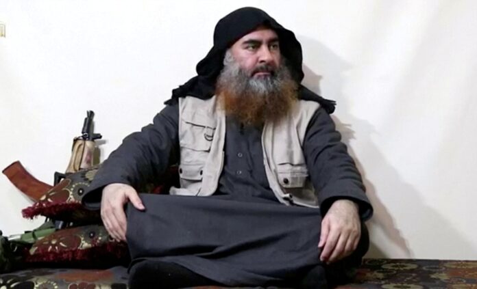Bearded man with IS leader al-Baghdadi's appearance speaks in this screen grab taken from video